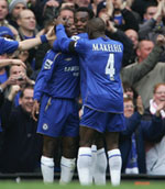 Michael Essien celebrates his first-ever goal for Chelsea