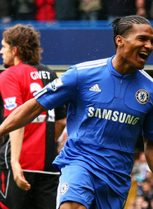 Florent Malouda celebrates his goal